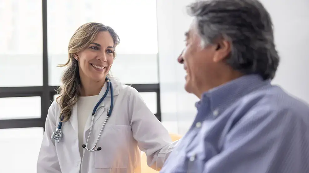 Patient Centered Medical Home near syracuse ny compassionate family medicine doctor talking with patient.webp