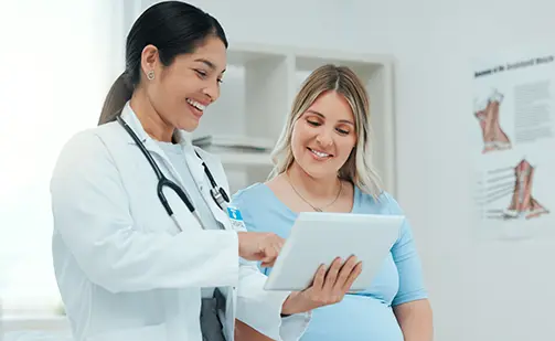womens health doctors near syracuse ny compassionate family medicine doctor showing patient charts