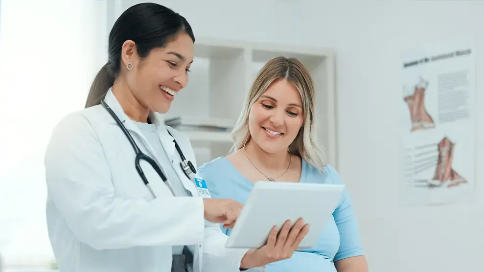 obgyn doctors near syracuse ny compassionate family medicine doctor showing patient charts.webp