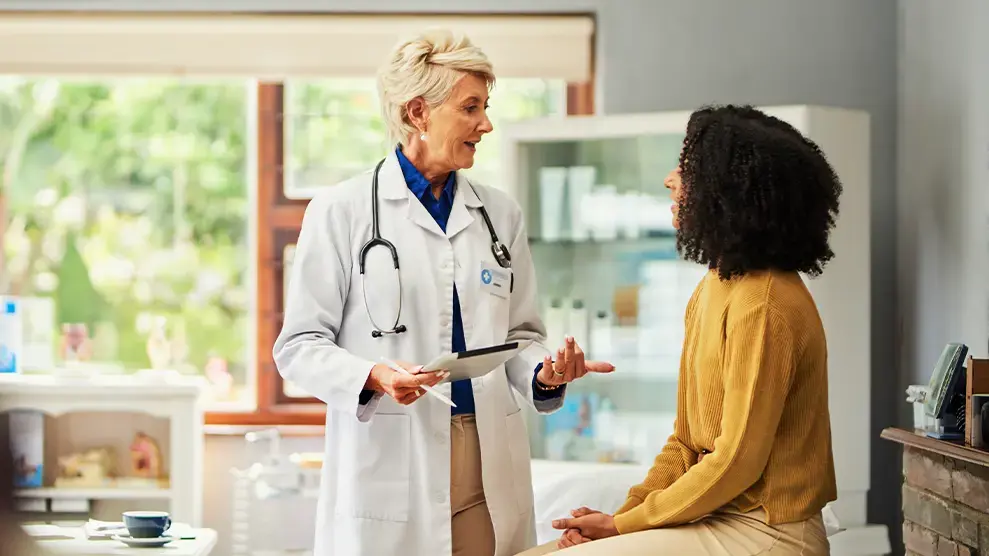 sexual wellness near syracuse ny compassionate family medicine doctor talking with patient.webp