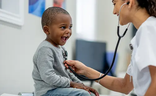 pediatrics near syracuse ny compassionate family medicine doctor checking childs breathing